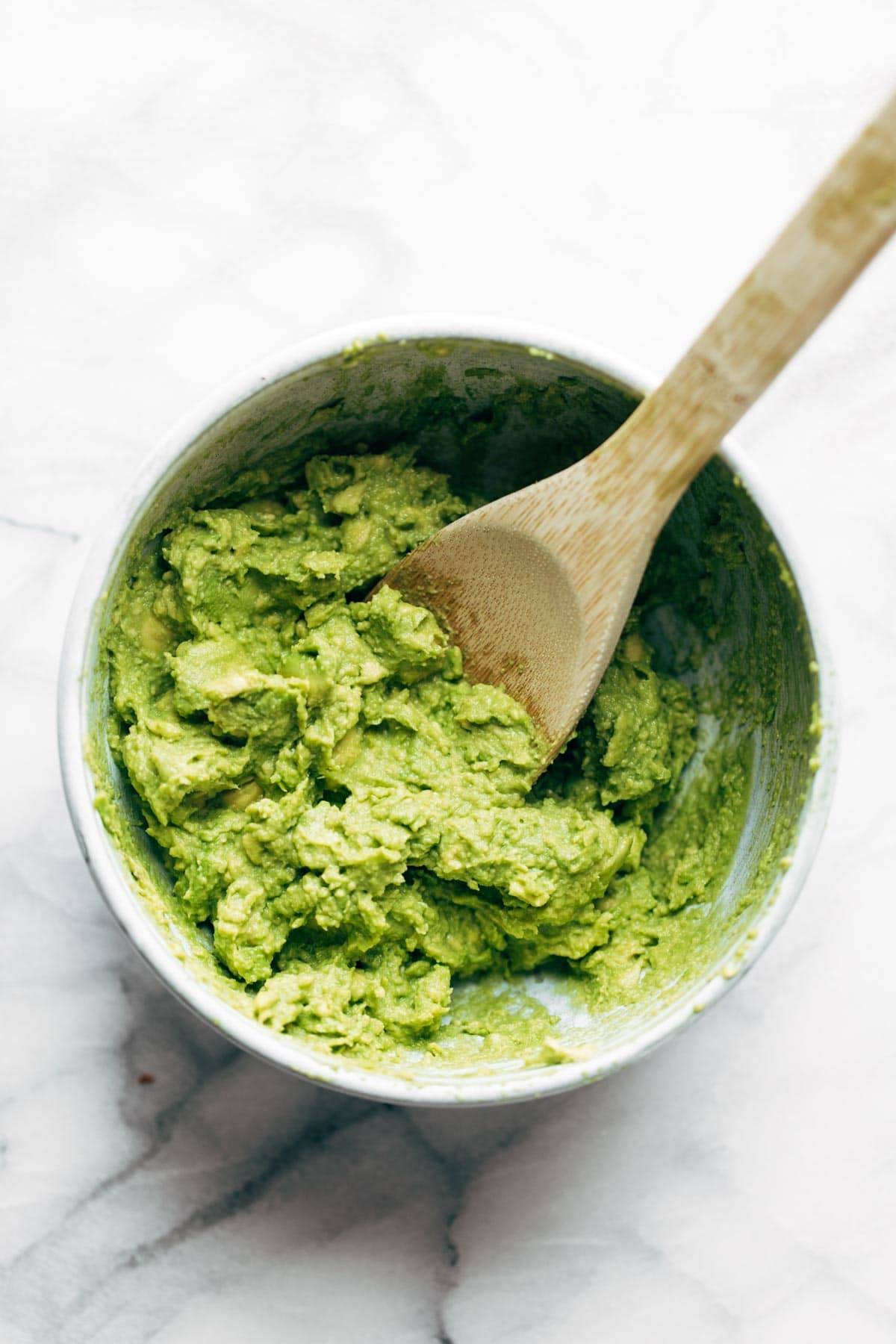 Avocado mashed in a bowl.