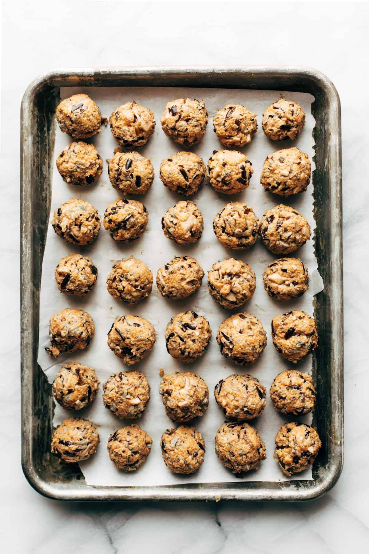 Vegetarian Swedish Meatballs rolled on baking sheet.