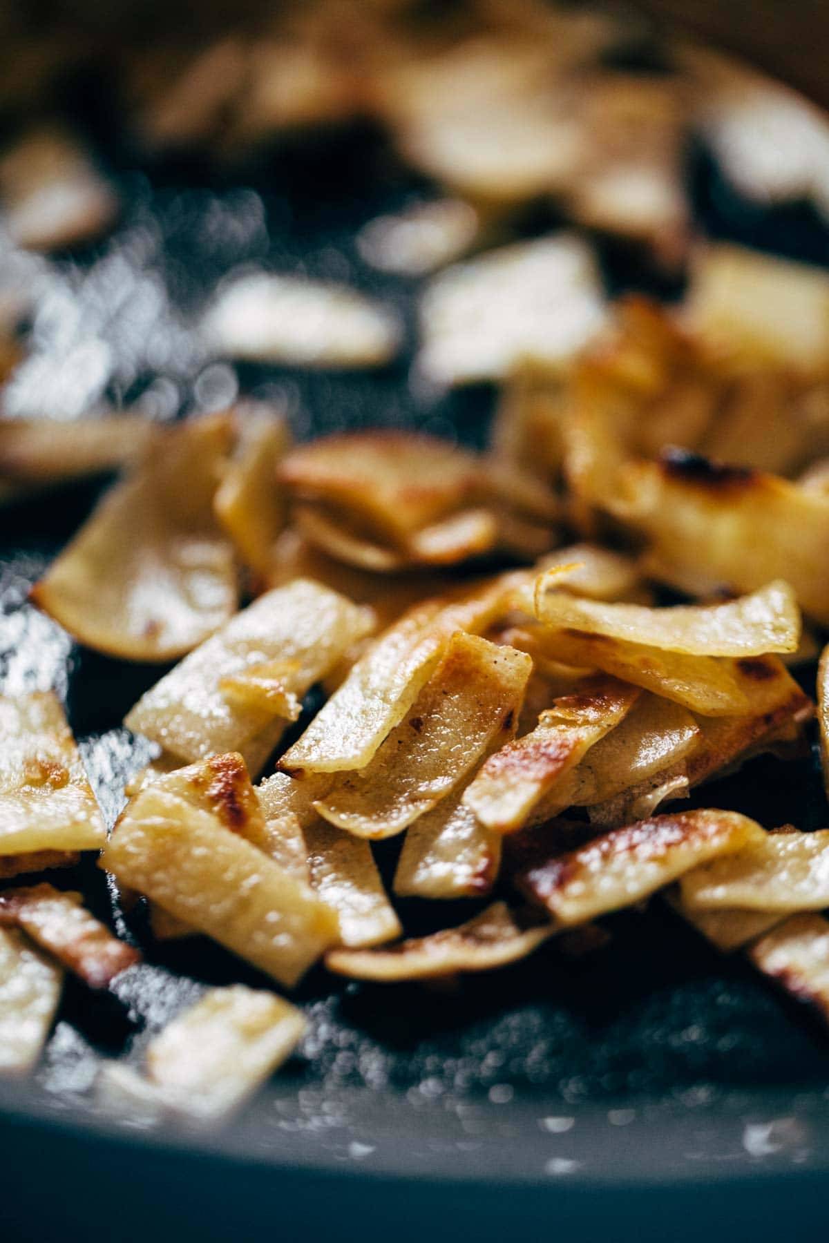 Tortillas for Migas in a pan.