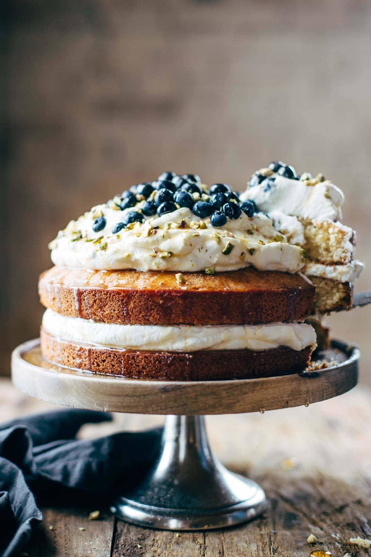 Cake on a cake stand with a napkin.