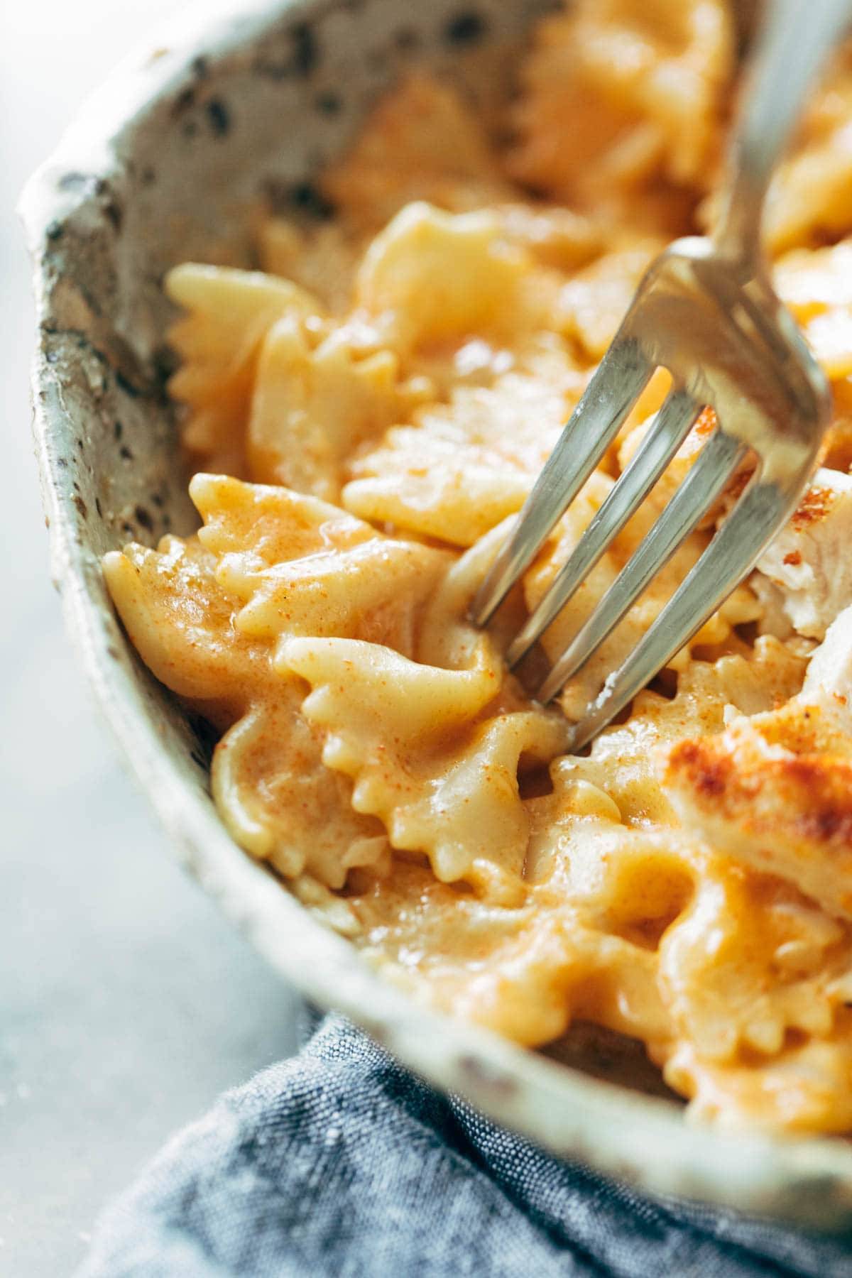 Taking a bite of paprika pasta.