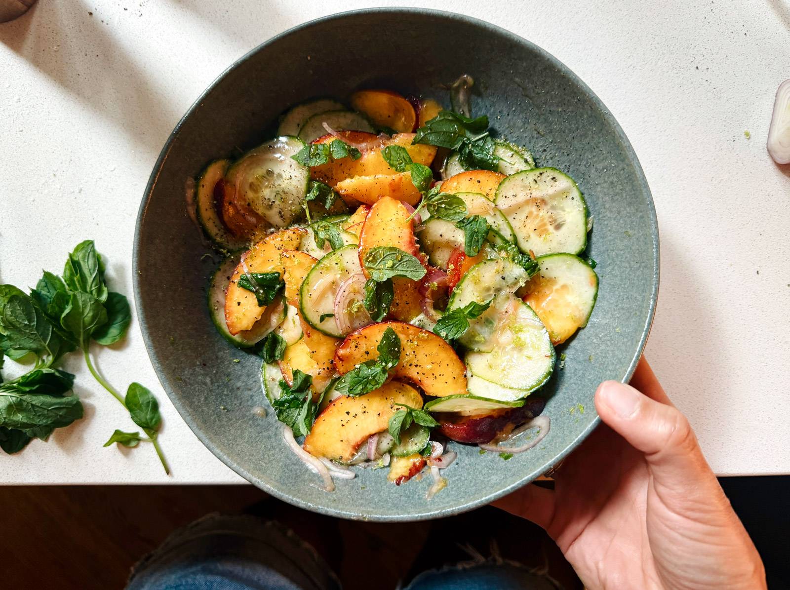 Finished peach salad in a bowl.