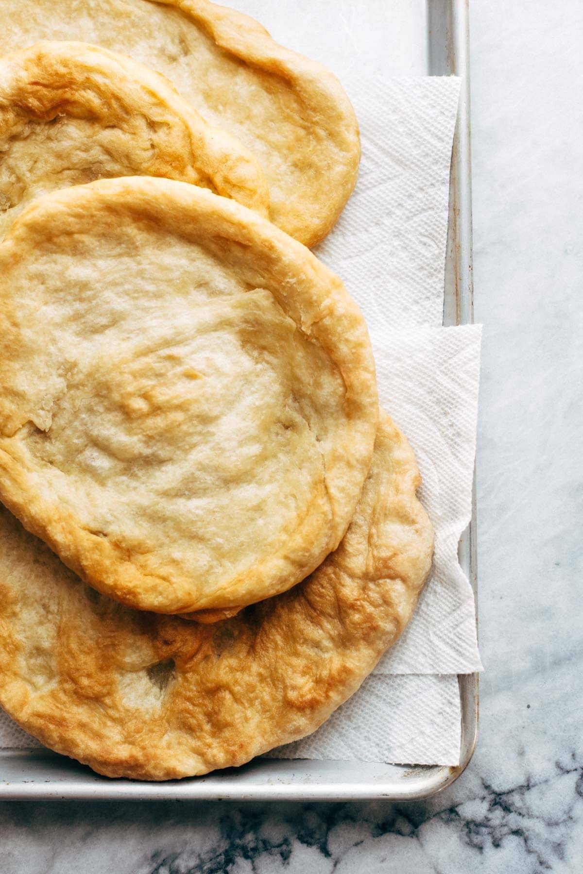 Fried Pizzas before baking on a sheet pan.