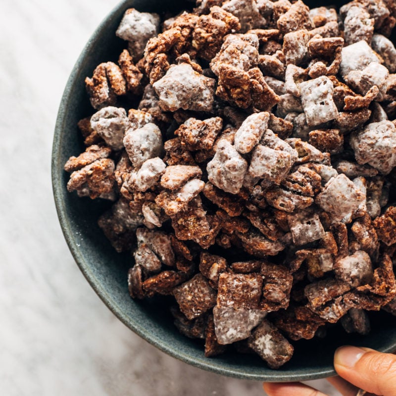 Puppy chow piled in a bowl.