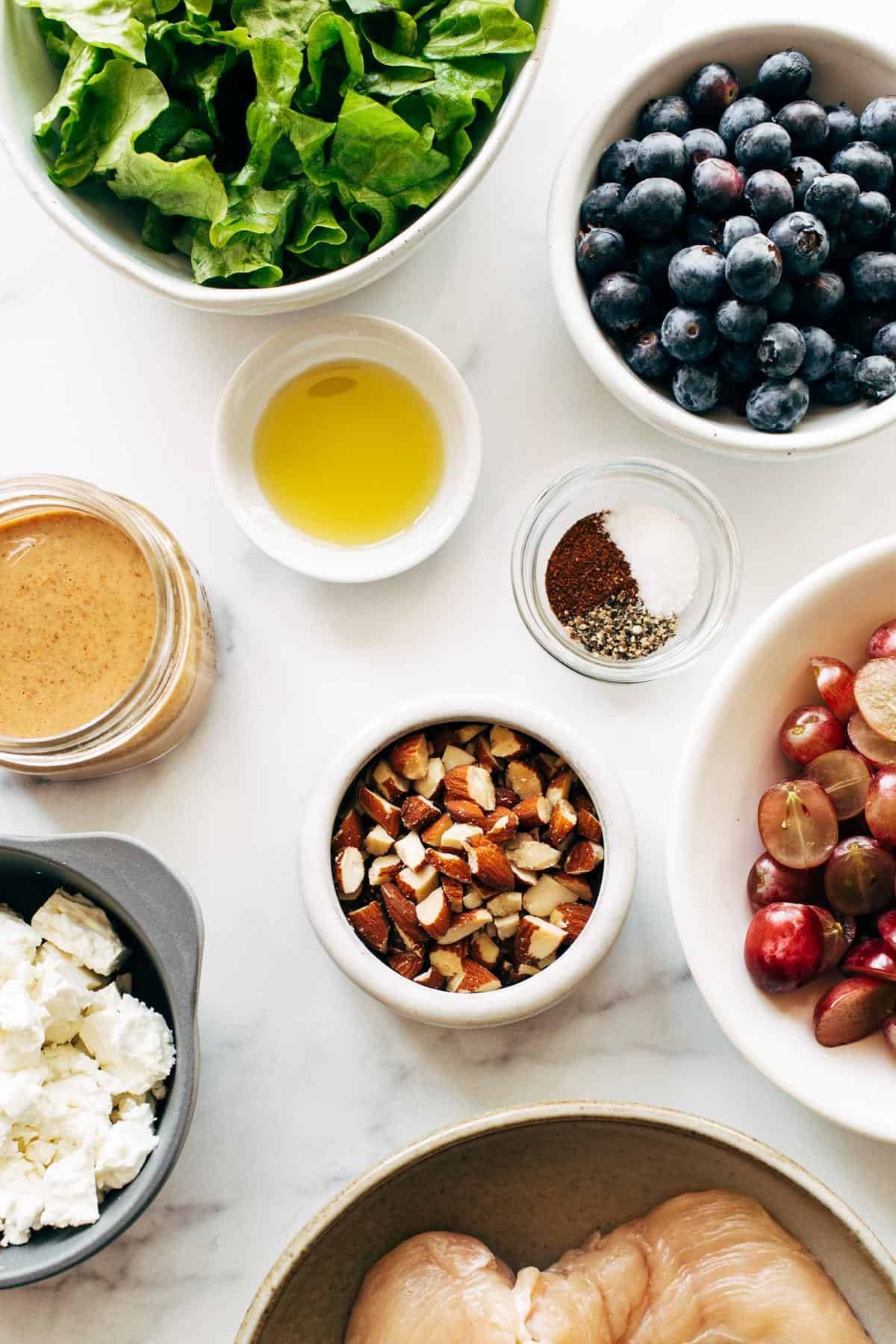 Ingredients for a rainbow chicken salad in bowls