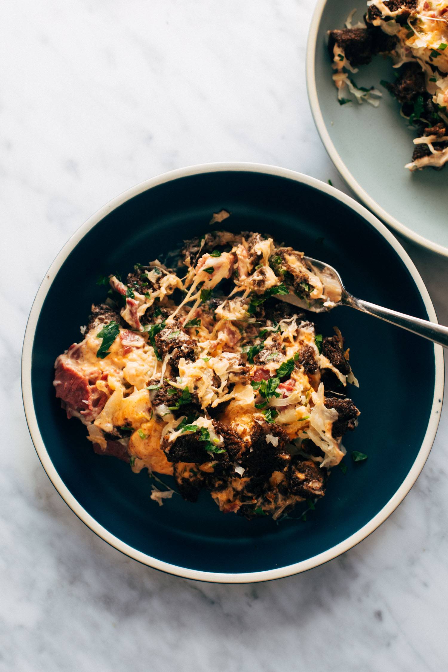 Reuben casserole on a plate with a fork