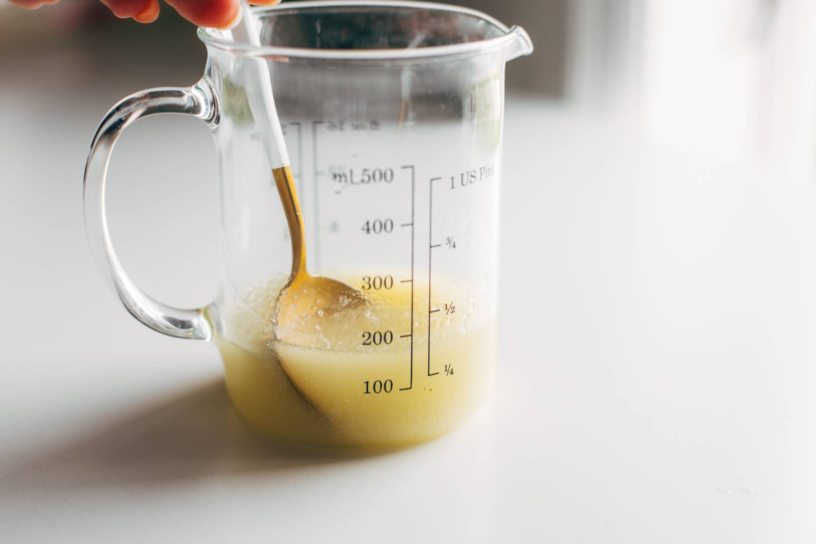 Peanut vinaigrette mixed up in a liquid measuring cup