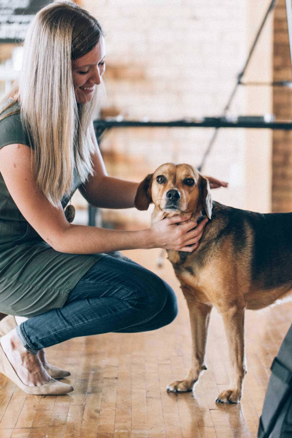 woman petting dog