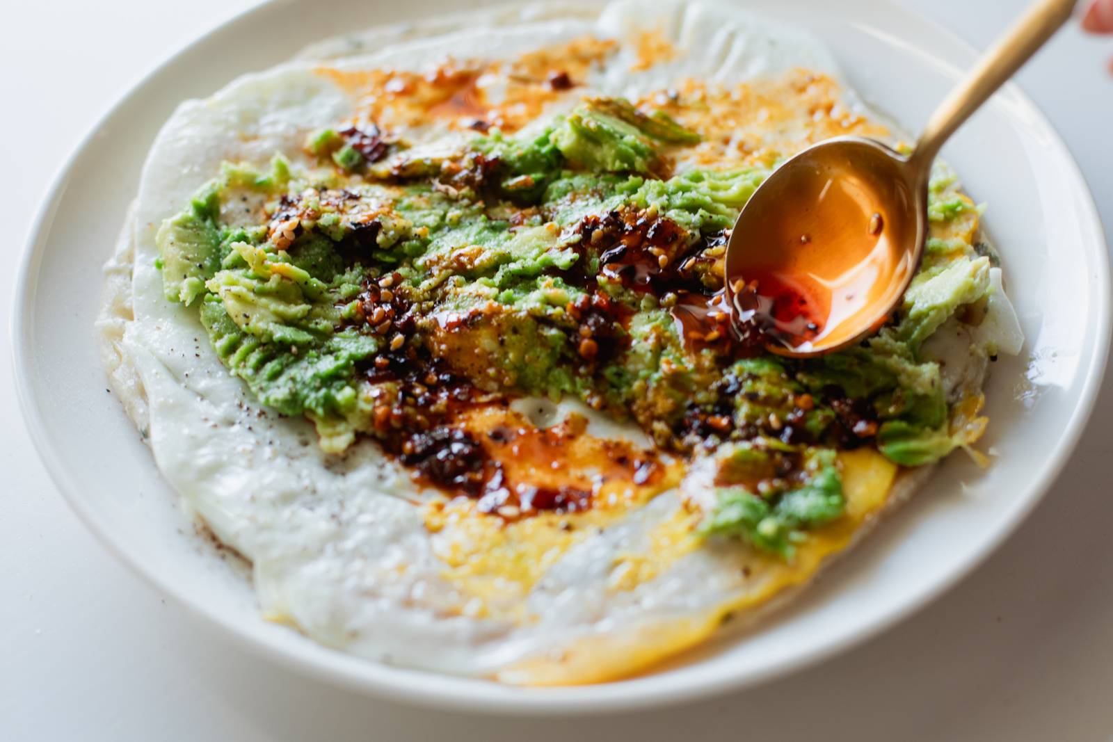 Adding toppings to scallion pancake.