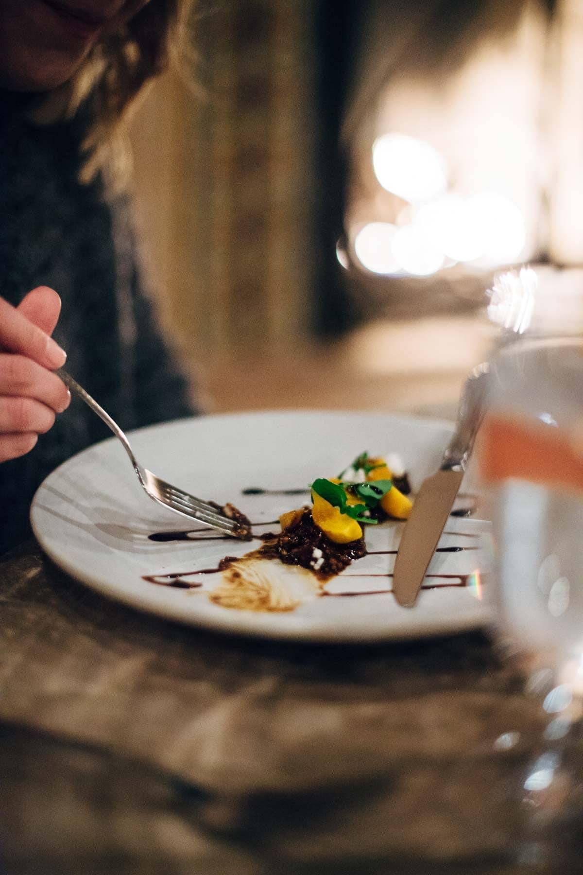 food on a plate with a fork and a knife