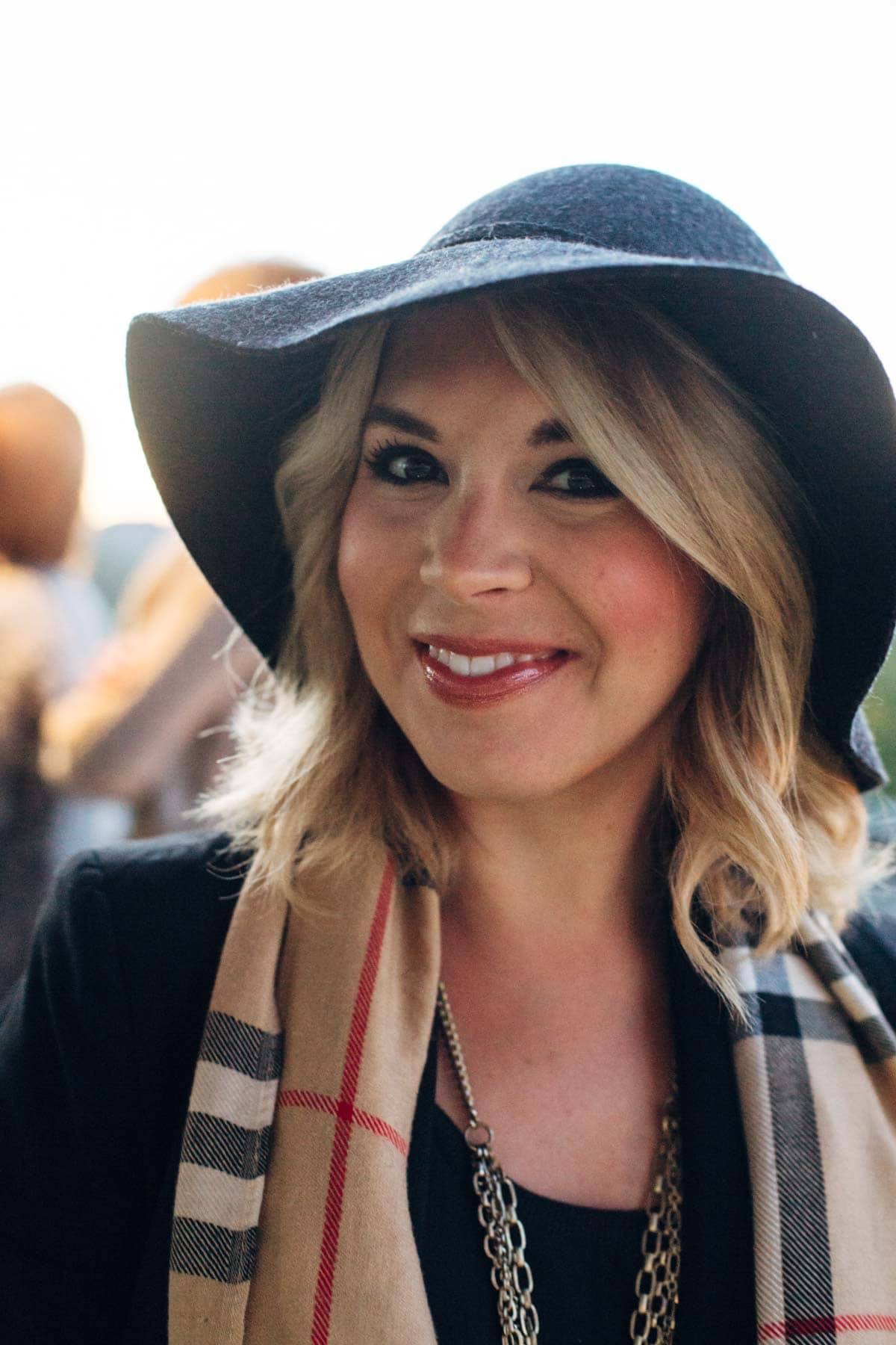 girl with hat and scarf smiling