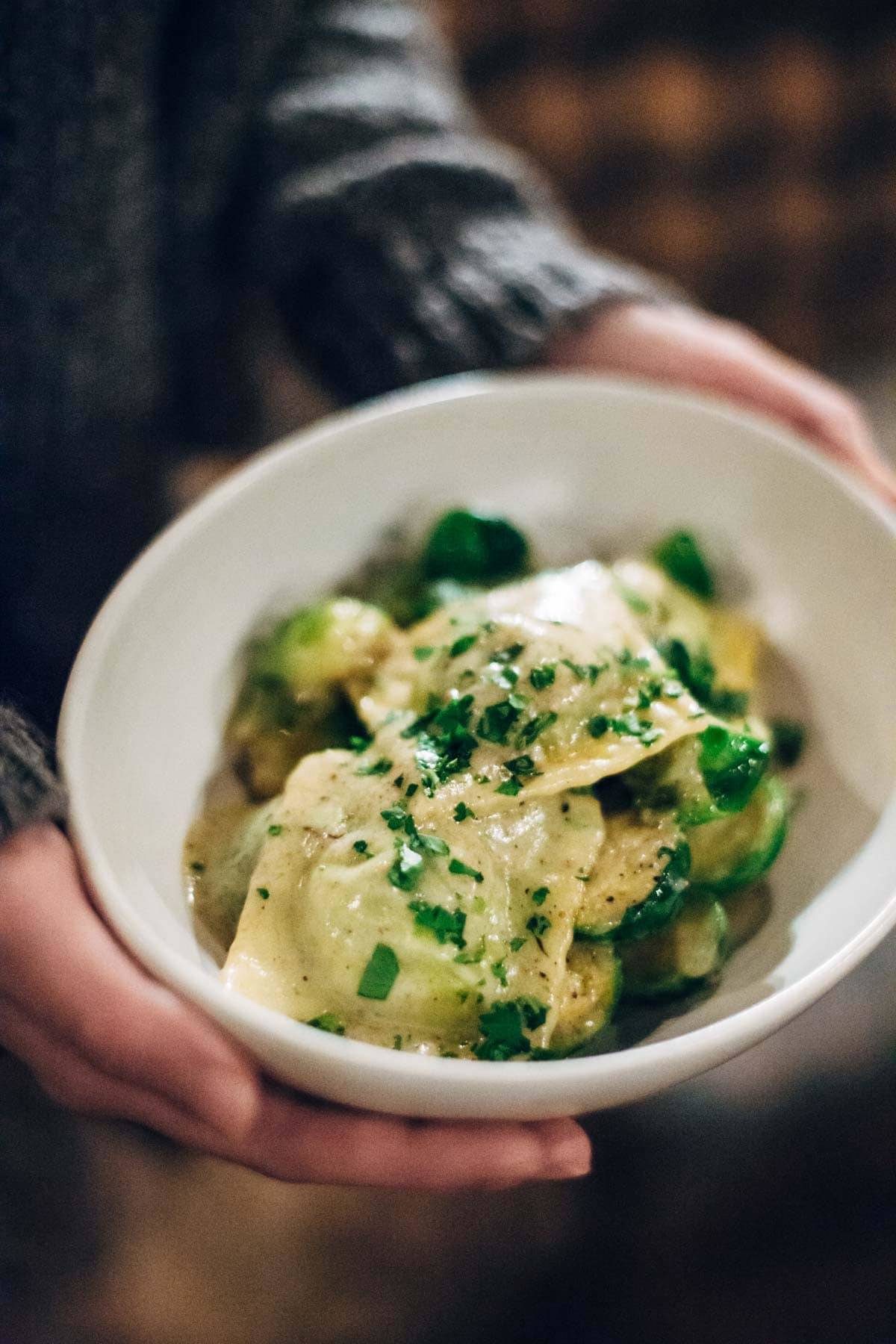 person holding food in a bowl