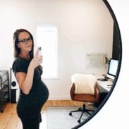 Lindsay taking selfie in an office.