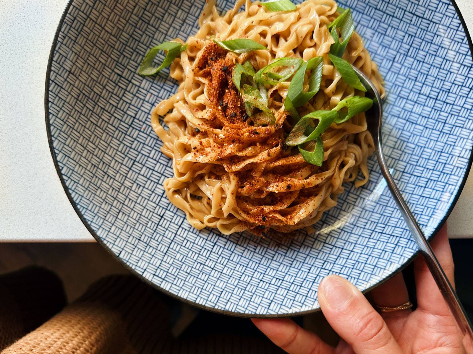 Sesame butter noodles in a bowl.