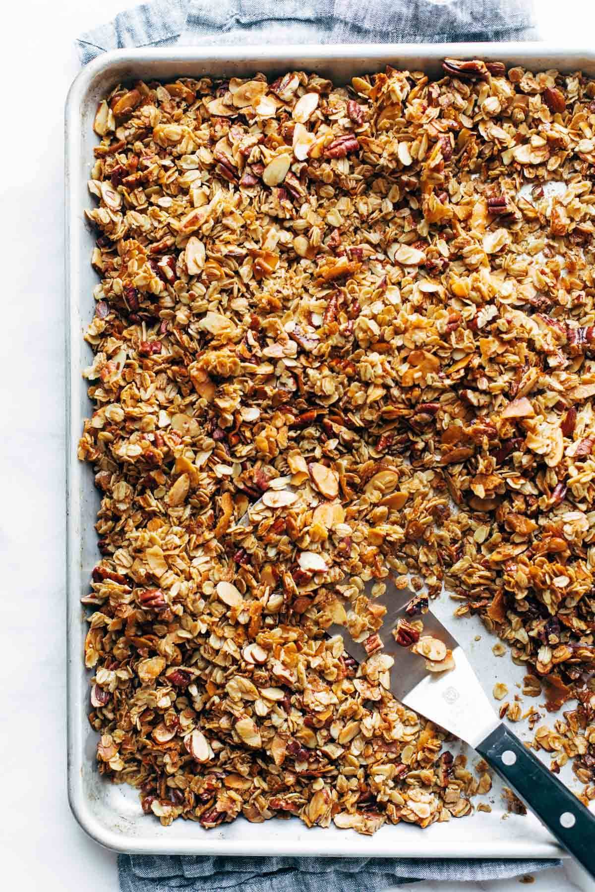 Baked granola on a baking sheet.