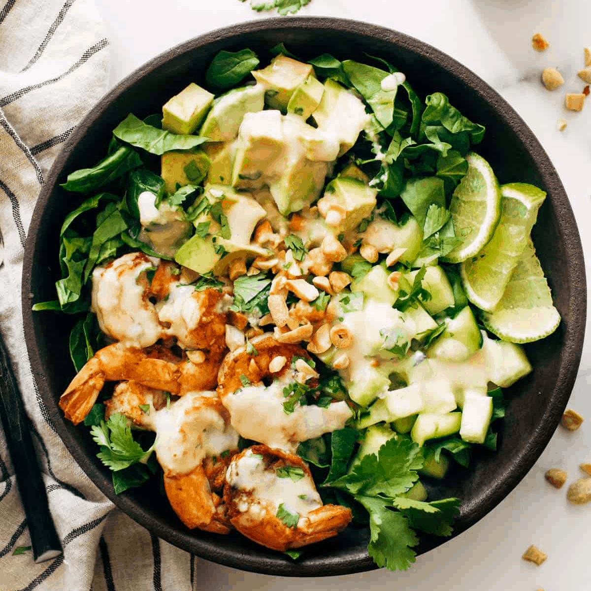 Avocado and Shrimp on a bed of greens.