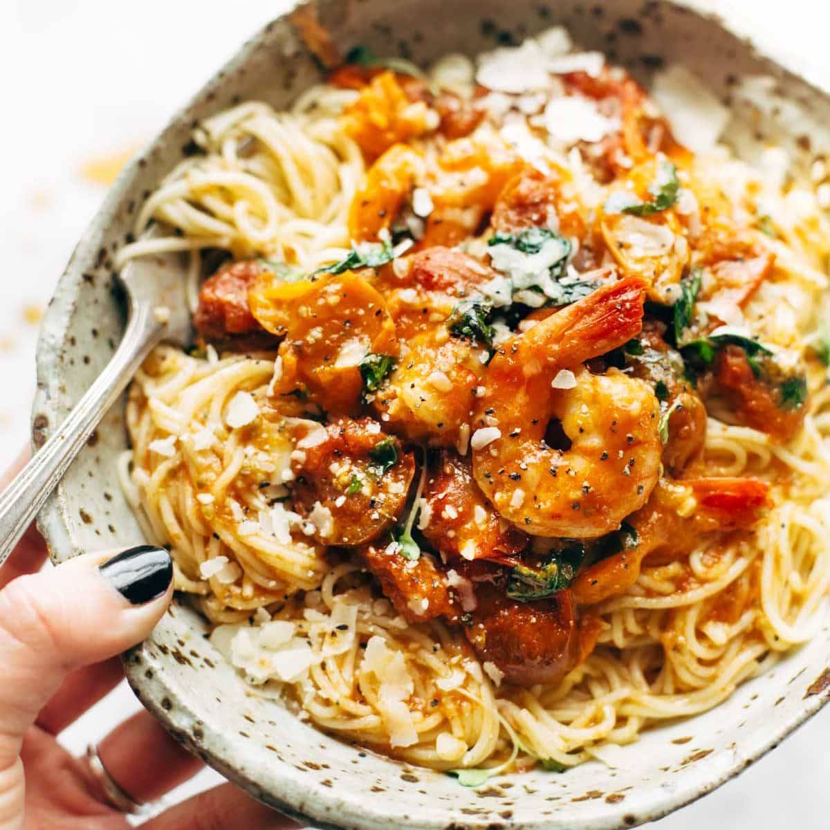 Capellini Pomodoro in a bowl with a fork.