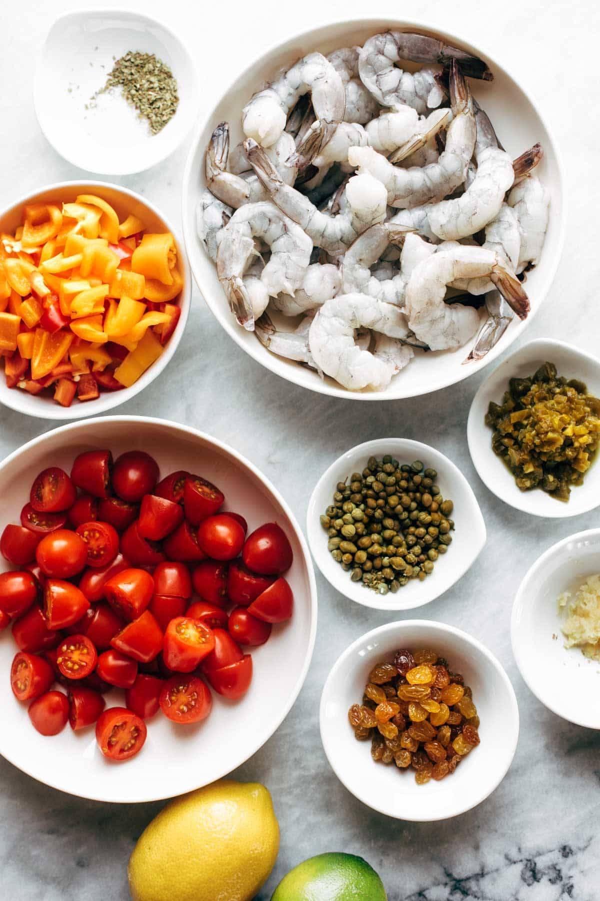 Ingredients for spicy shrimp veracruz in bowls.