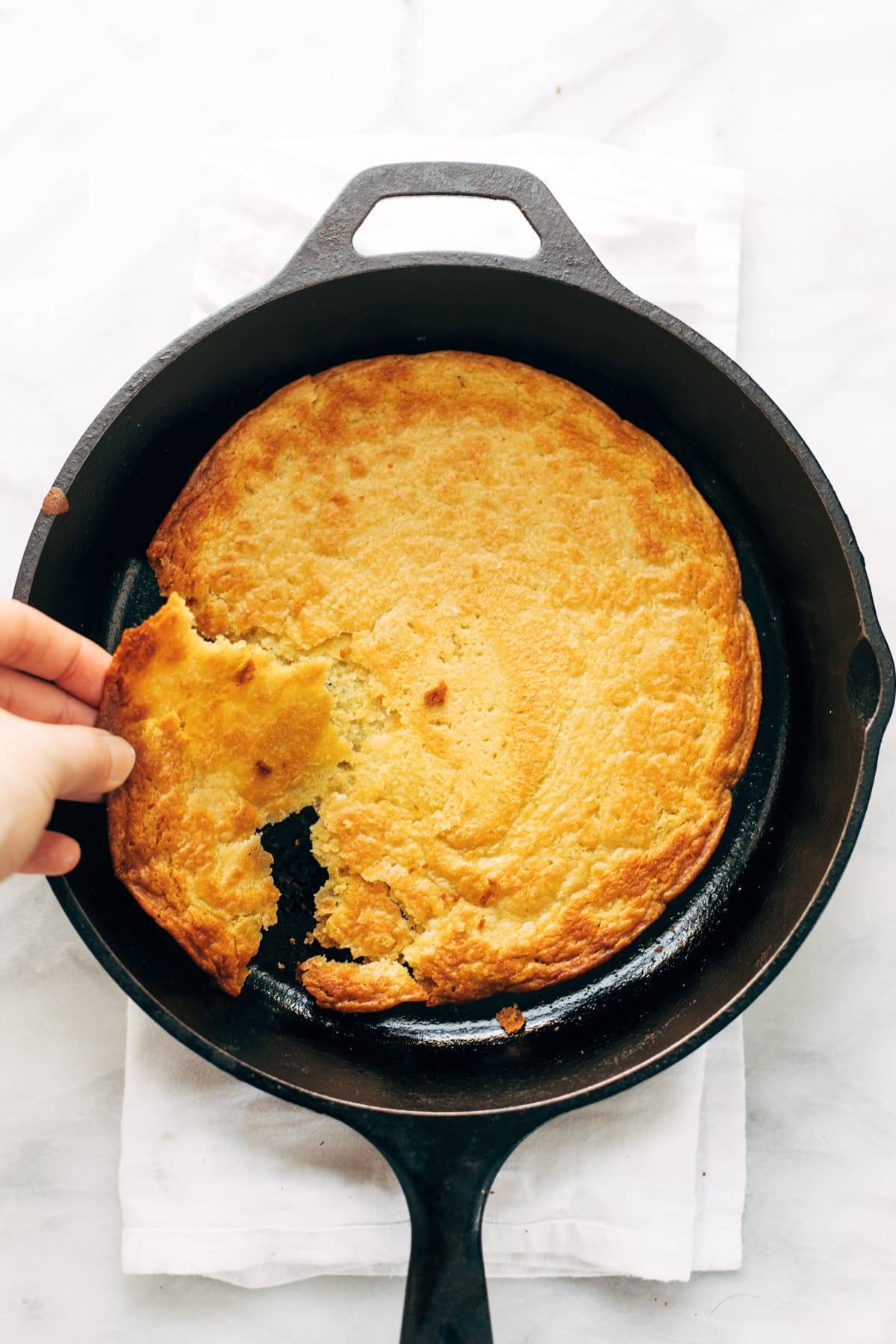 Socca baked in a cast iron pan.