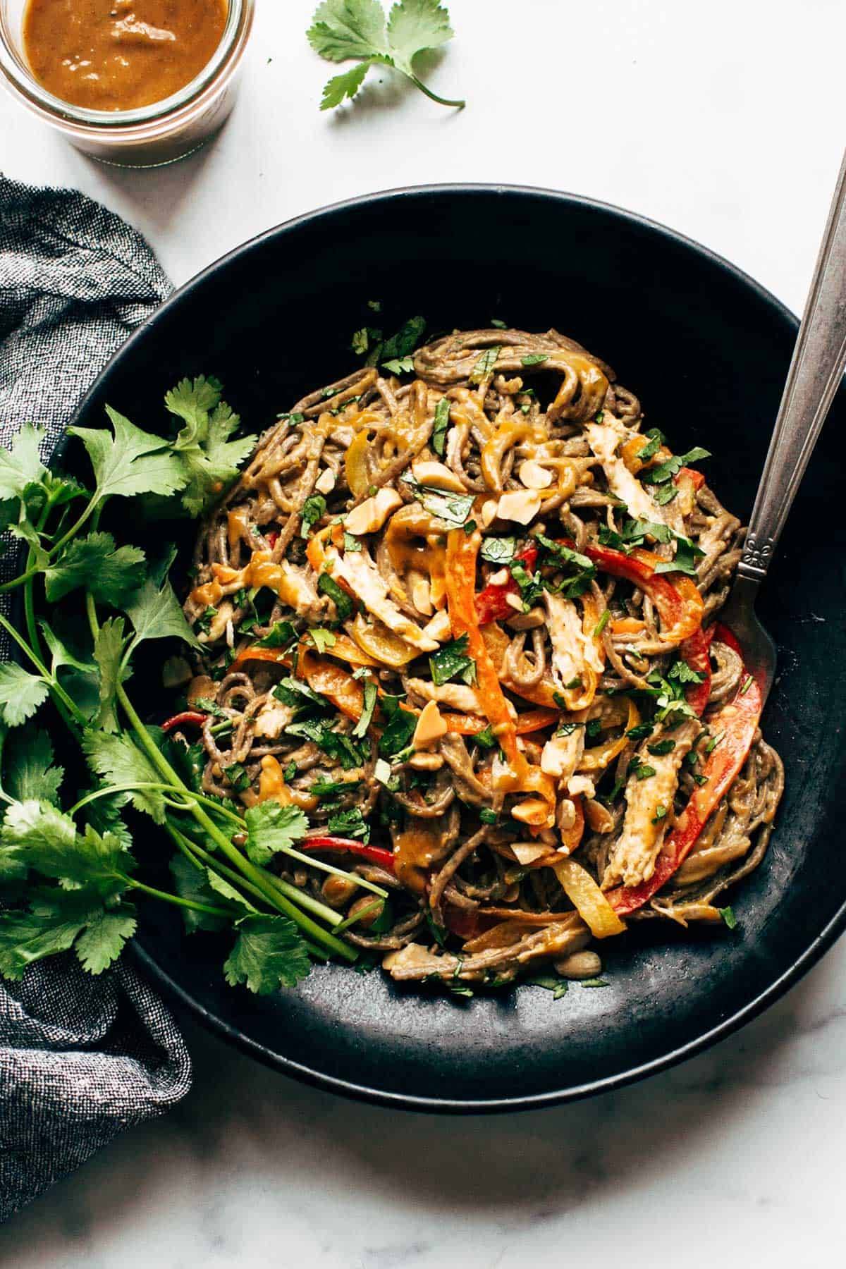 Spicy Peanut Soba Noodle Salad in a bowl with a fork.