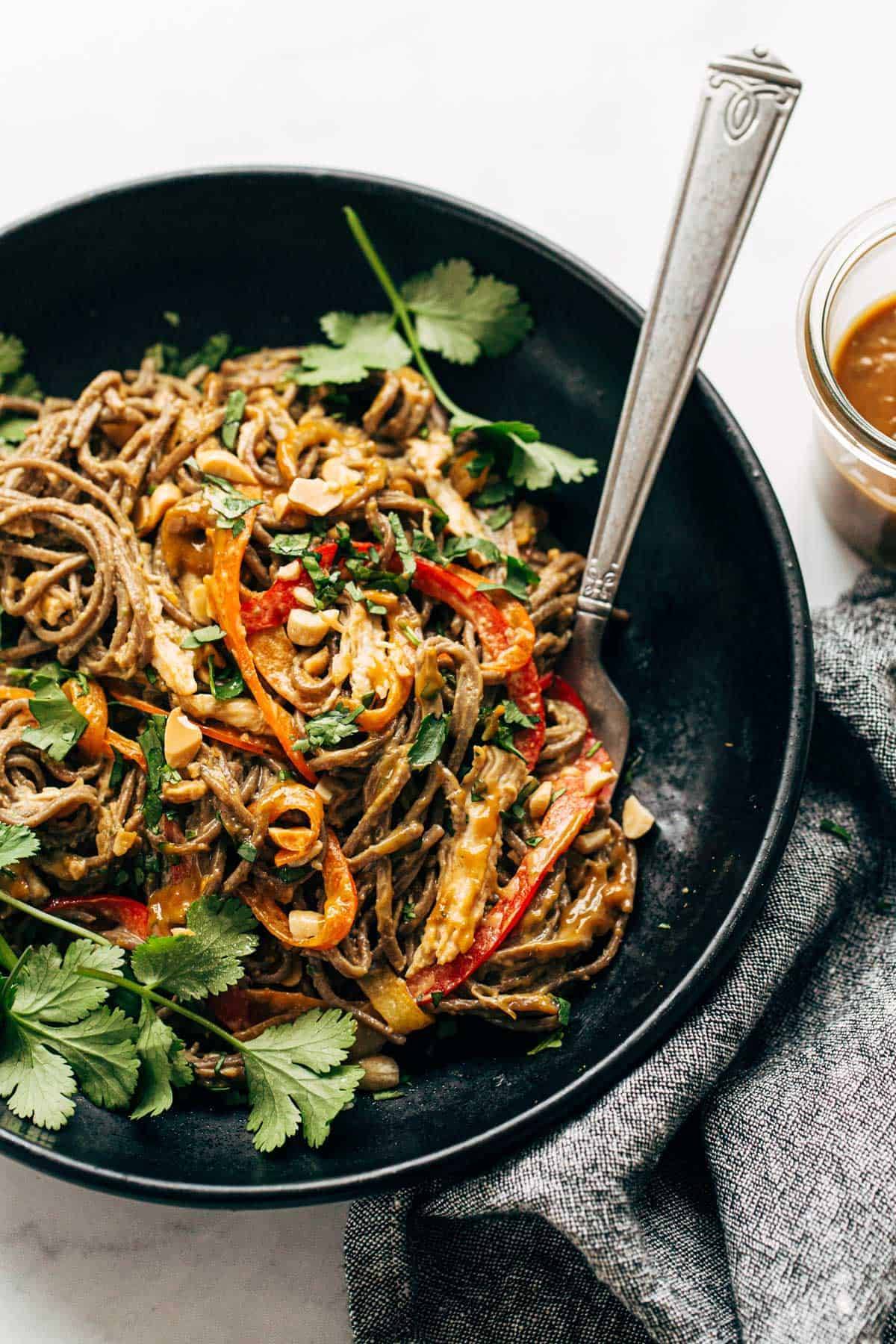 Spicy Peanut Soba Noodle Salad in a bowl with a fork.