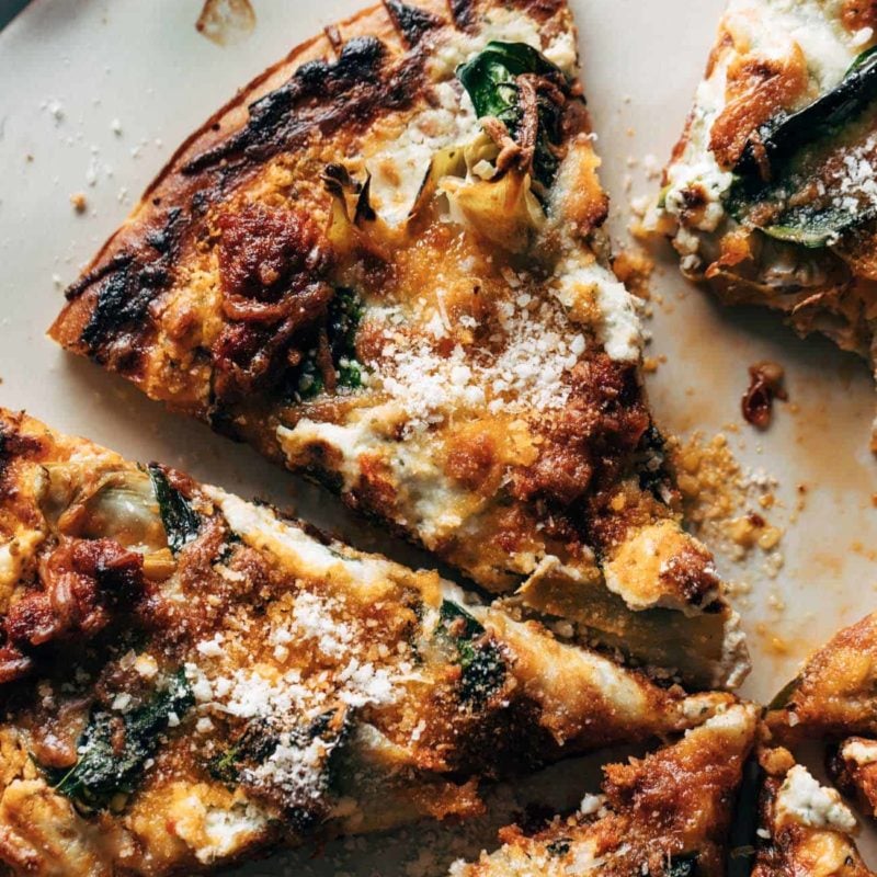 Slices of pizza sitting on a pizza pan.