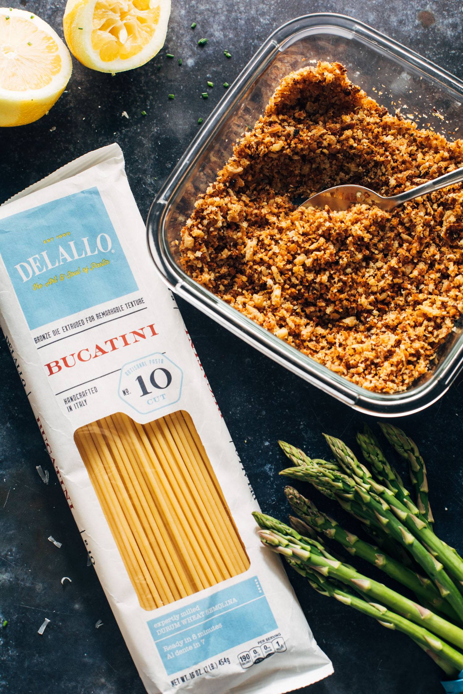 Overhead shot of pasta, breadcrumbs, and asparagus