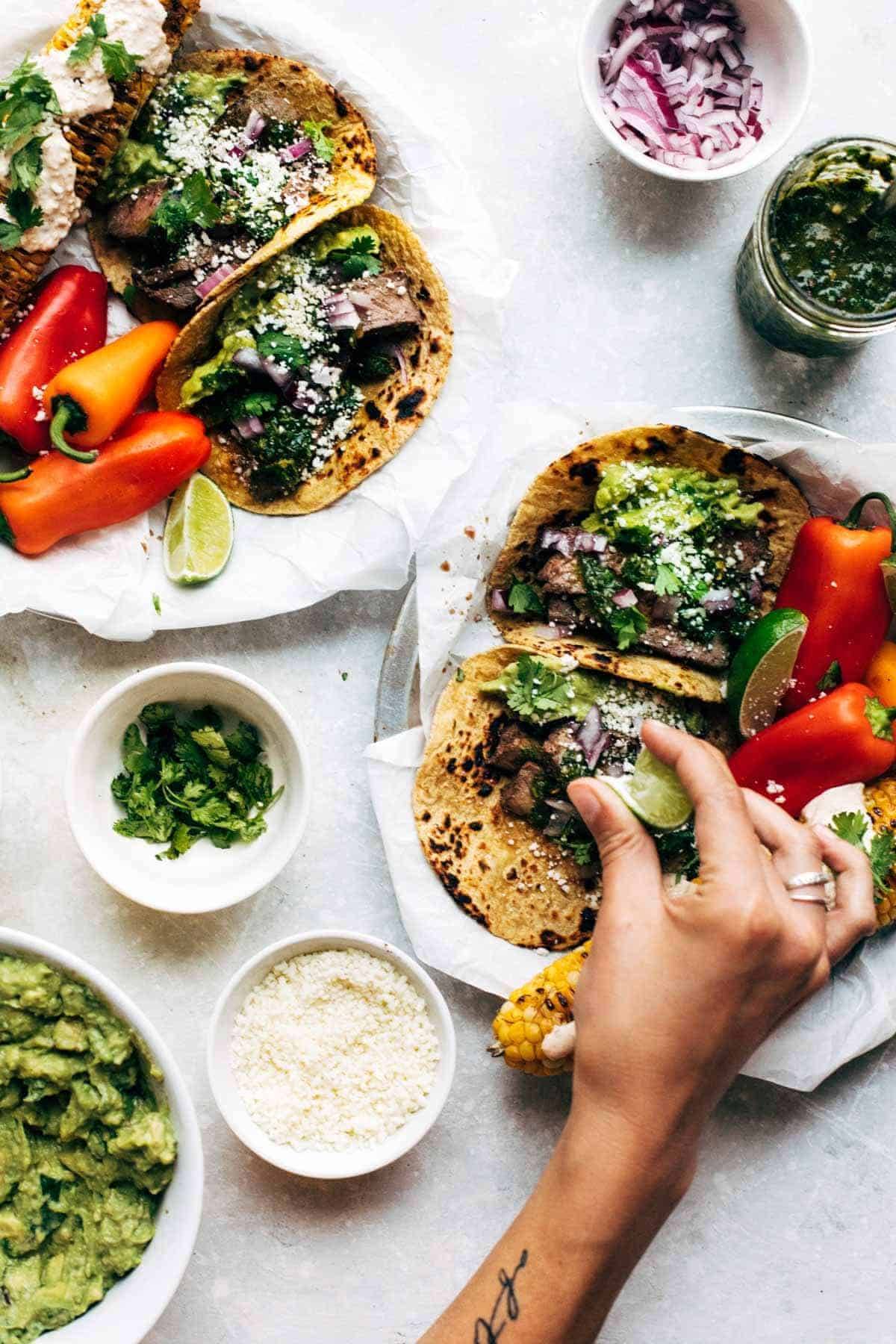 Chimichurri Steak Tacos with limes and peppers