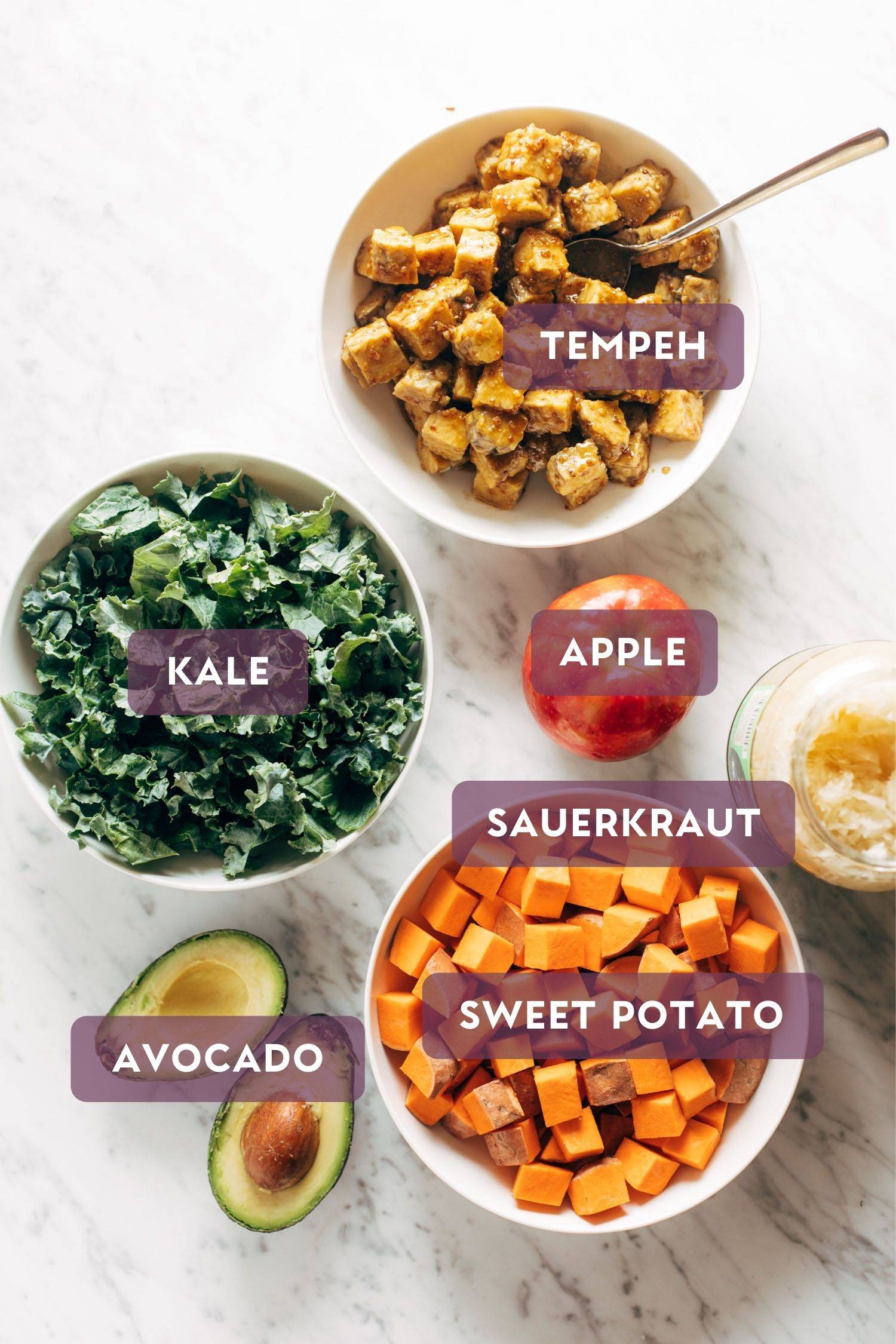 Ingredients for maple mustard tempeh bowls. Each ingredient has text over the top in a purple bubble. 