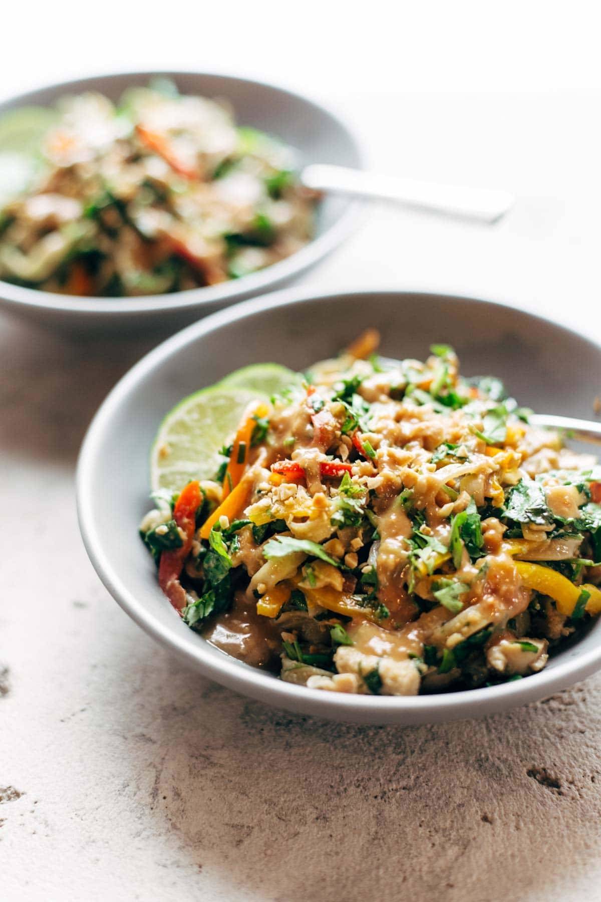 Thai Noodle Salad with Peanut Lime Dressing in bowls with forks