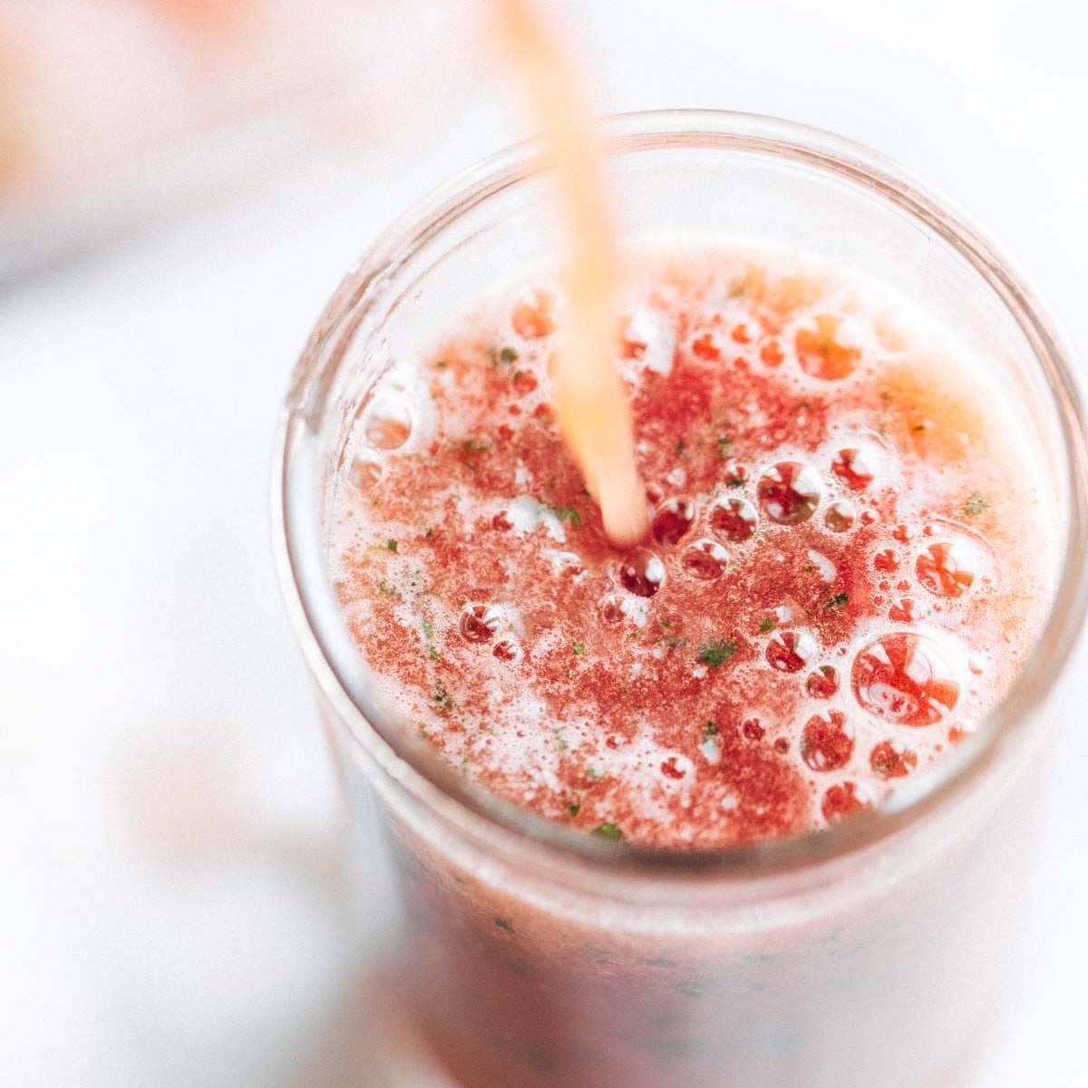 Watermelon Smoothie being poured into a glass.