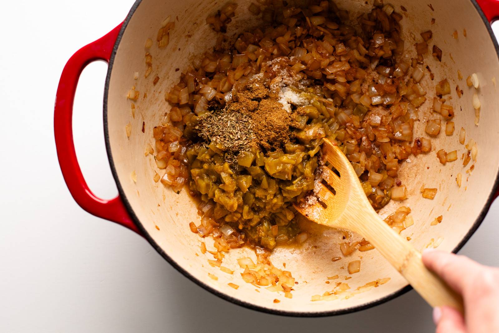 Cooking onions, garlic, and spices for white chicken chili