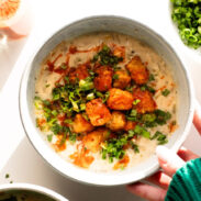 White Chicken Chili in a bowl with tots on top.