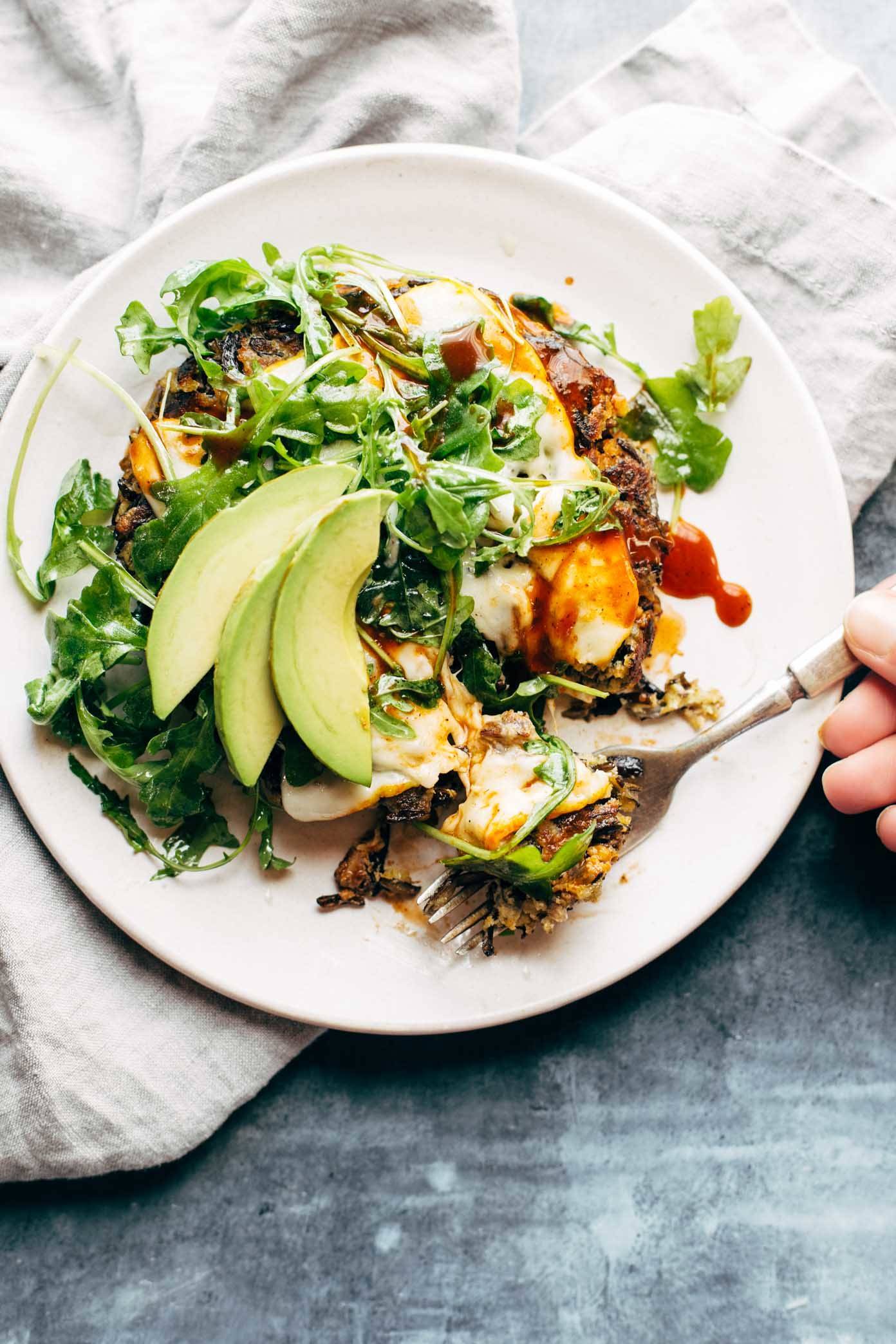 Wild Rice Burger on a plate with a fork and avocado.