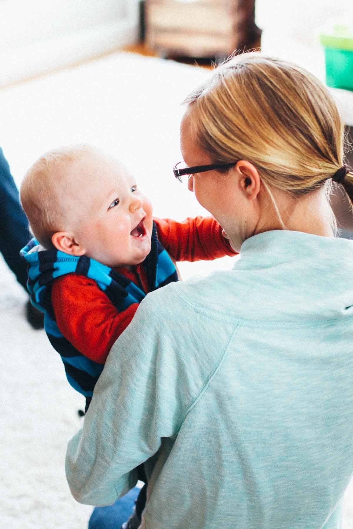 Woman holding a baby boy.