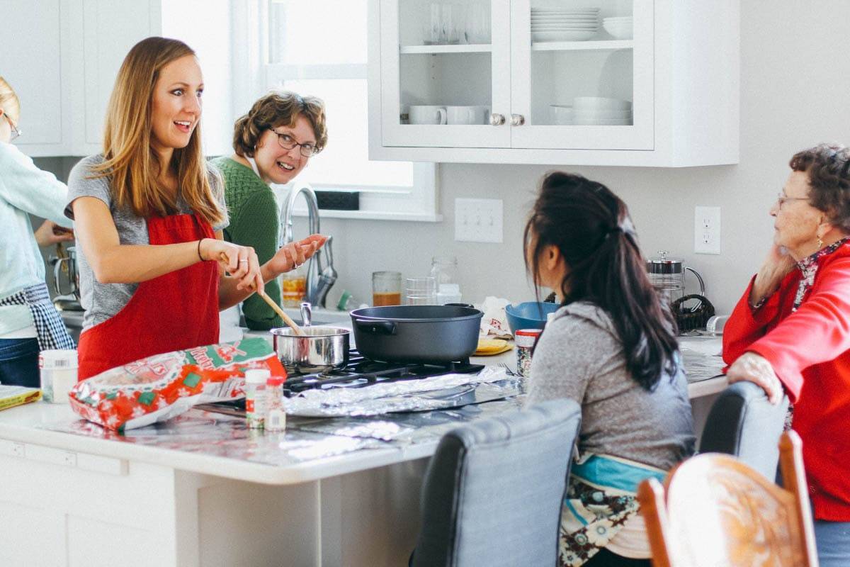 People baking in a kitchen.