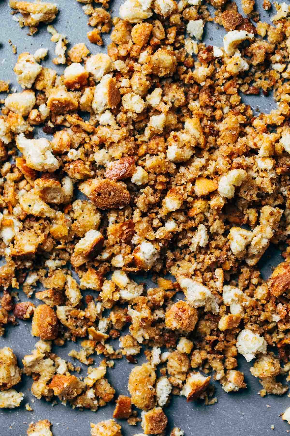 Breadcrumbs on a sheet pan.