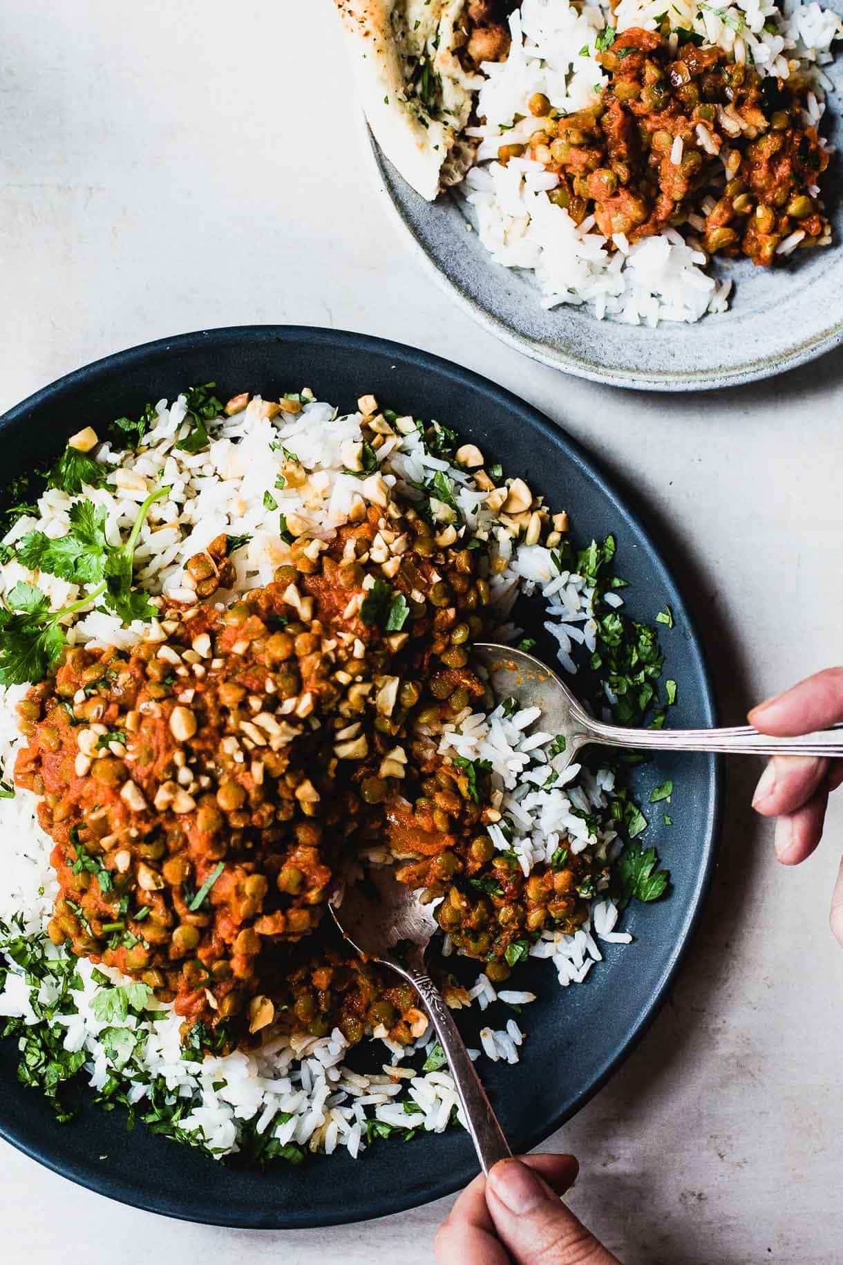 Red curry lentils on plate with rice.