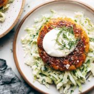 Salmon Burger on a plate with slaw.